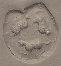 A Mesopotamian Yellow Jasper Stamp Seal with the Head of a Lion