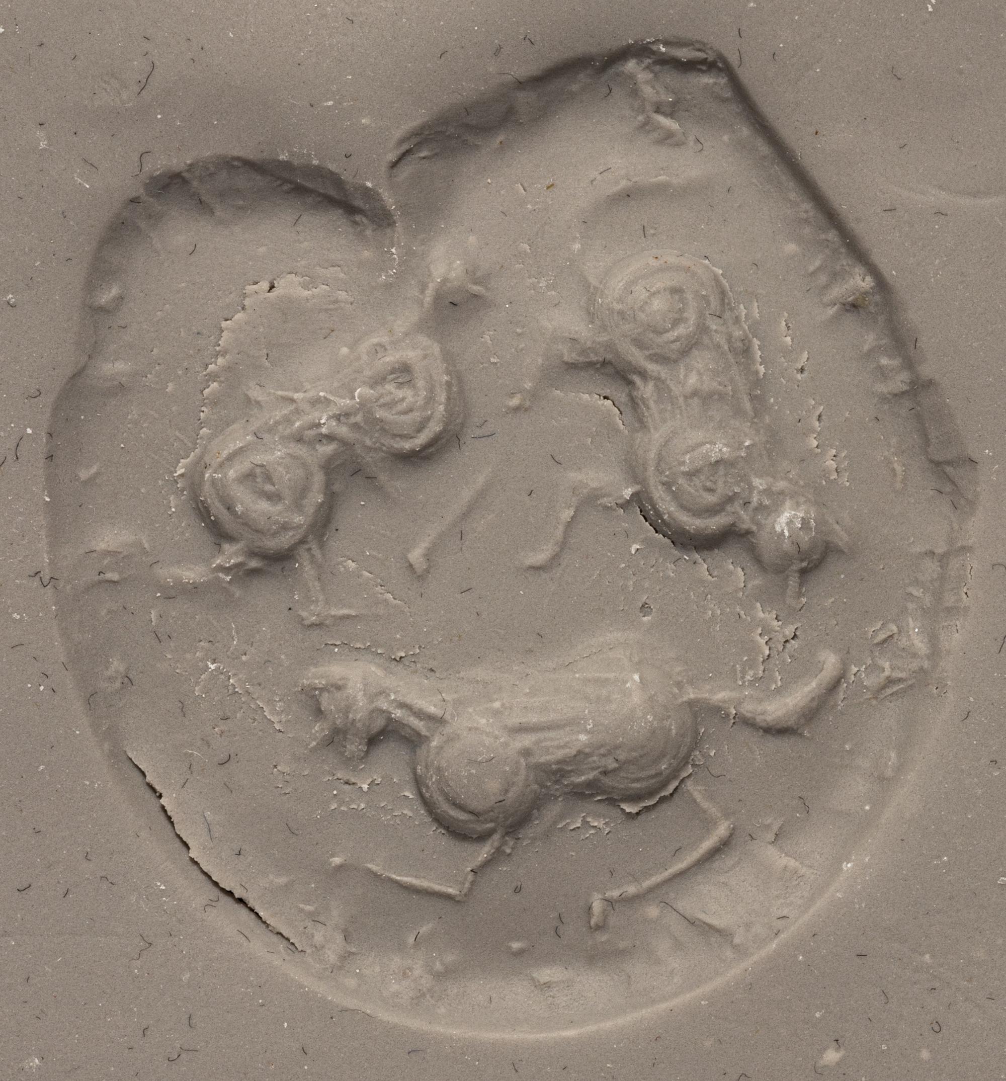 A Mesopotamian Yellow Jasper Stamp Seal with the Head of a Lion