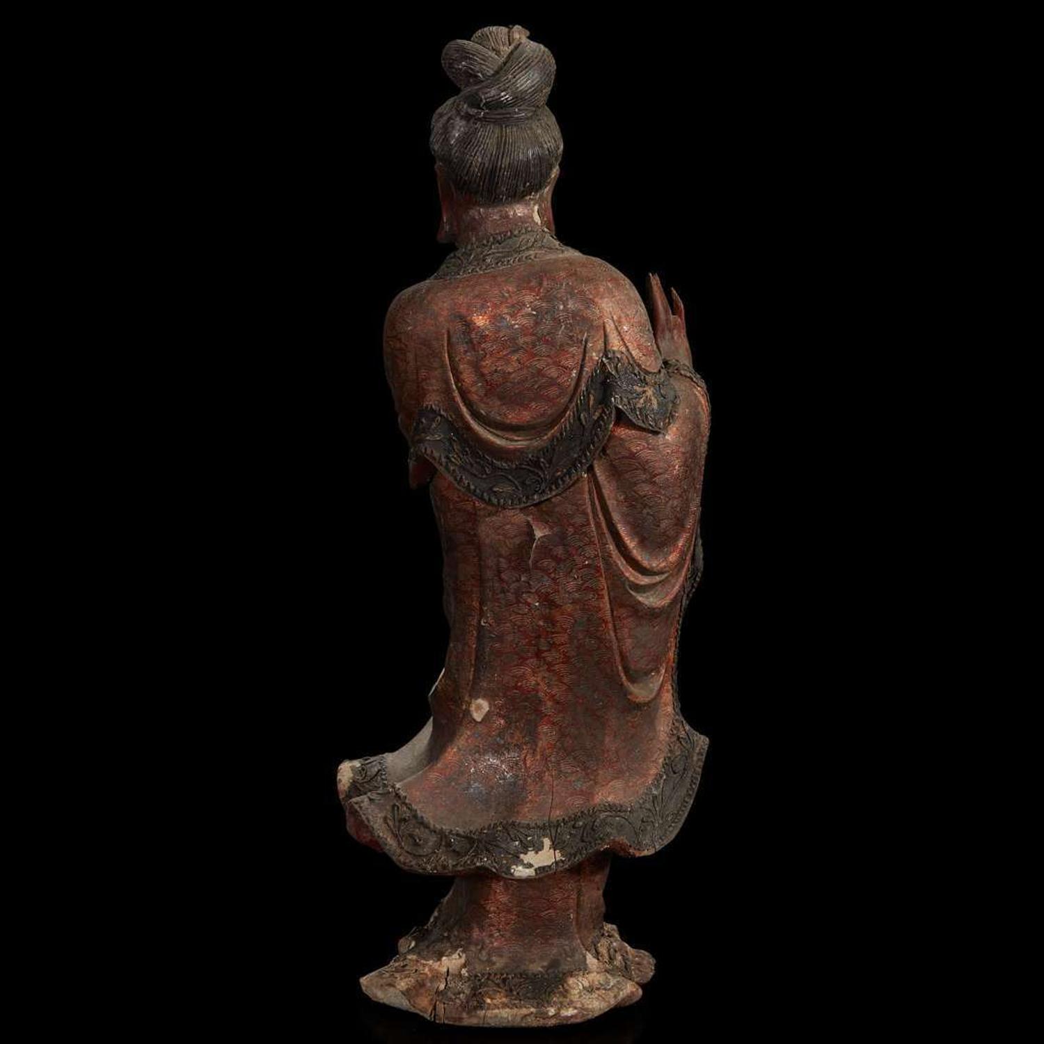 A Chinese carved and lacquered wood figure of Guanyin