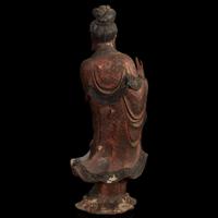 A Chinese carved and lacquered wood figure of Guanyin