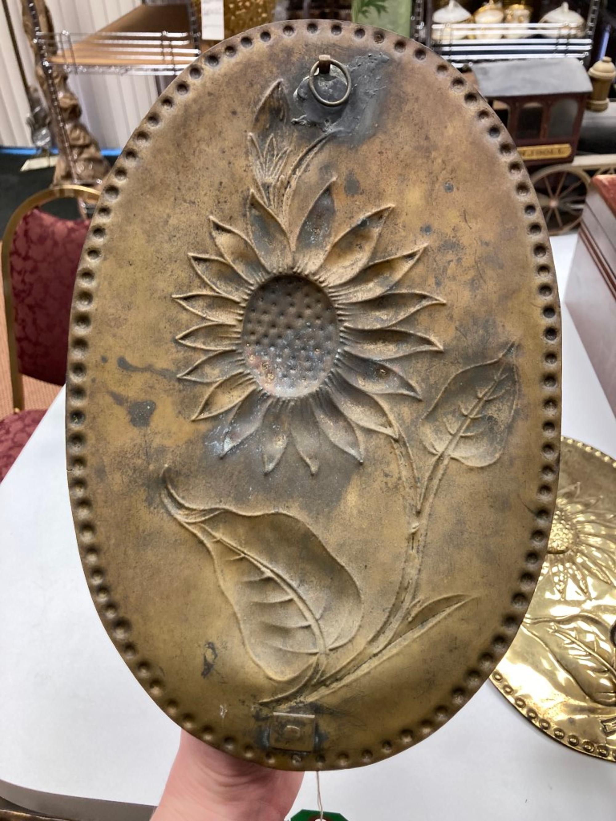 A Pair of Dutch Brass Sunflower Decorated Wall Sconces