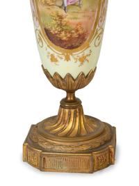 A Pair of Gilt Bronze Mounted Sèvres Style Porcelain Urns