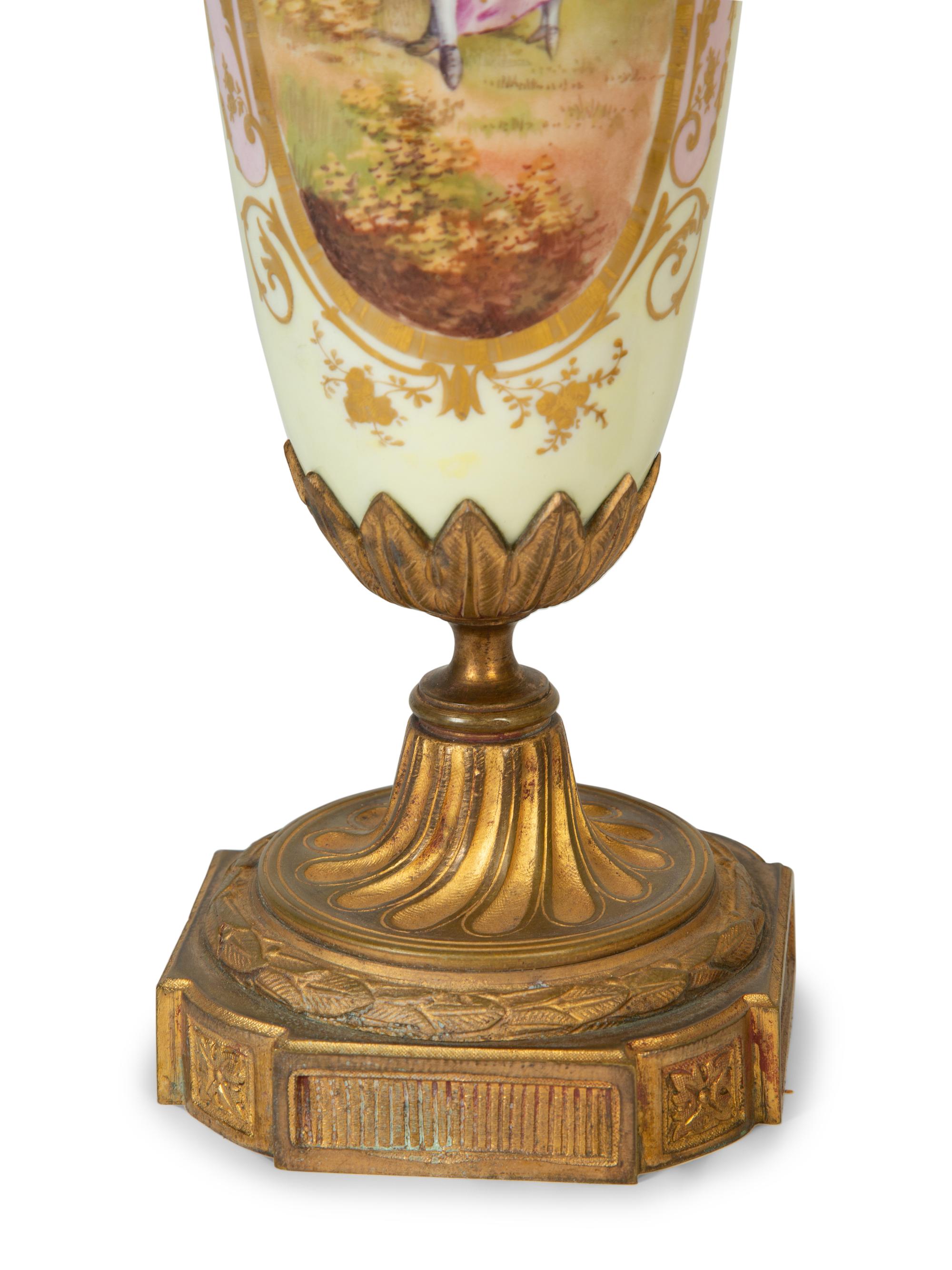 A Pair of Gilt Bronze Mounted Sèvres Style Porcelain Urns