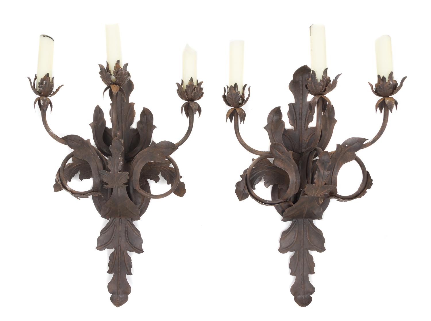 A Pair of Wrought Metal Three-Light Sconces Height 26 inches.