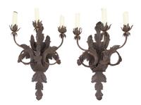 A Pair of Wrought Metal Three-Light Sconces Height 26 inches.
