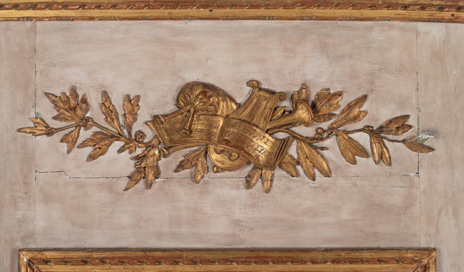 A Louis XVI Gray Painted and Parcel Gilt Pier Mirror