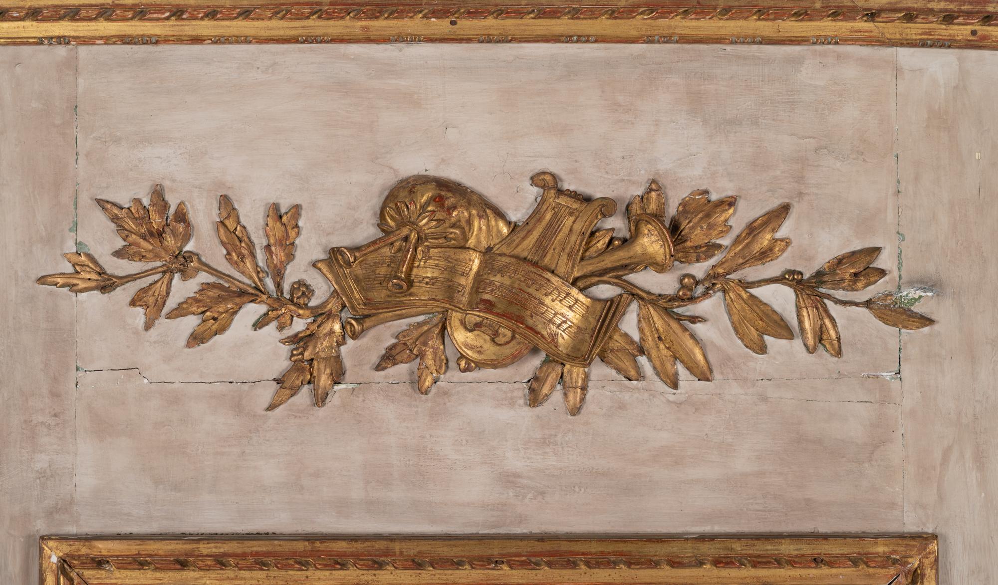 A Louis XVI Gray Painted and Parcel Gilt Pier Mirror