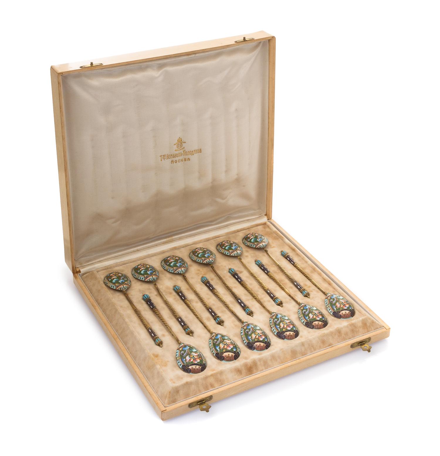 A Set of Twelve Russian Silver and Enamel Spoons, Mark of 20th Artel, Moscow, early 20th century, each having an enameled finial surmou