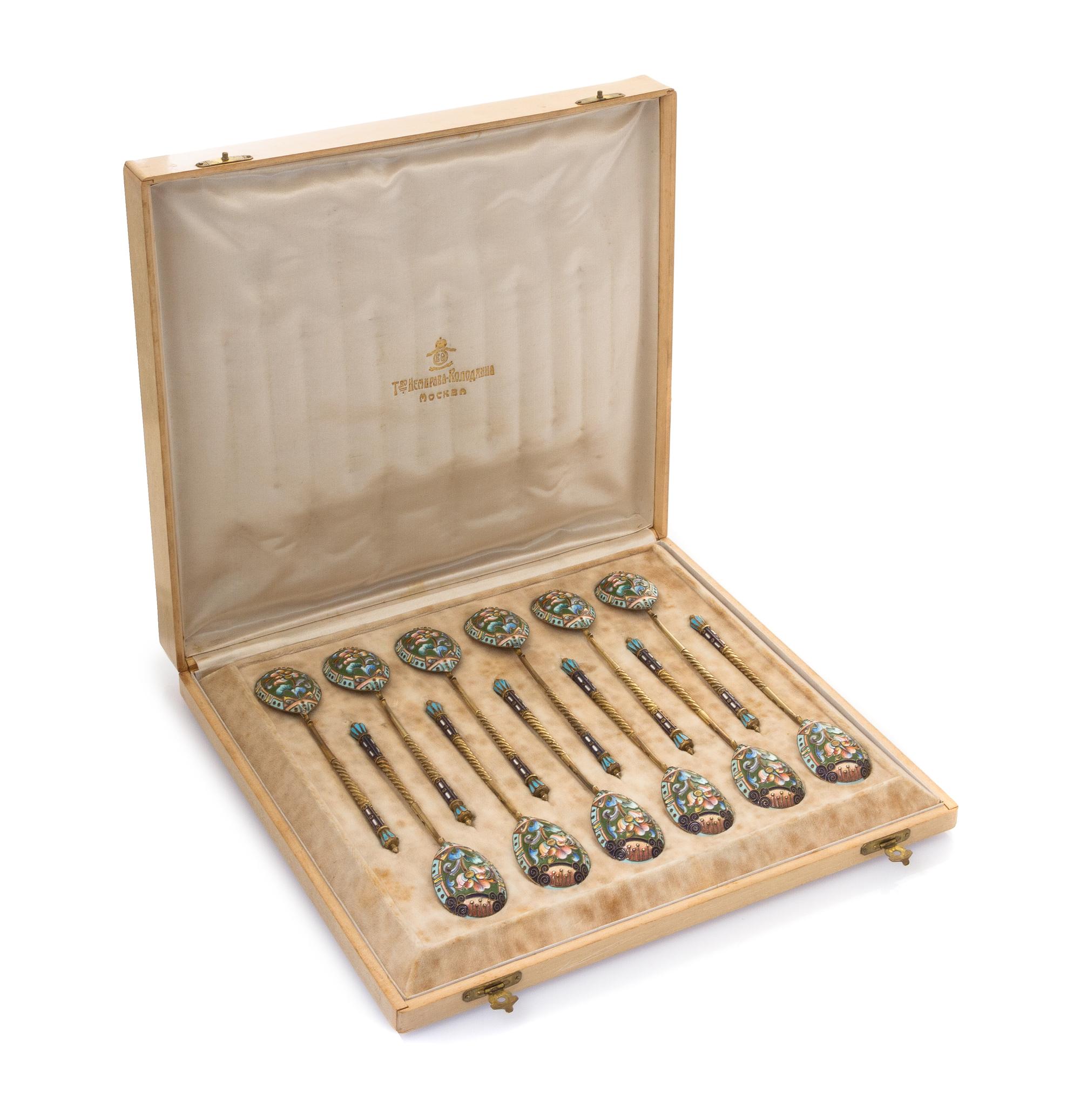 A Set of Twelve Russian Silver and Enamel Spoons, Mark of 20th Artel, Moscow, early 20th century, each having an enameled finial surmou