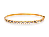 An 18 Karat Yellow Gold, Diamond and Sapphire Bangle Bracelet,