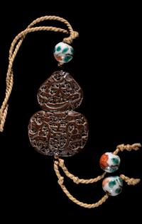 Two Chinese Carved Wood Pendants
