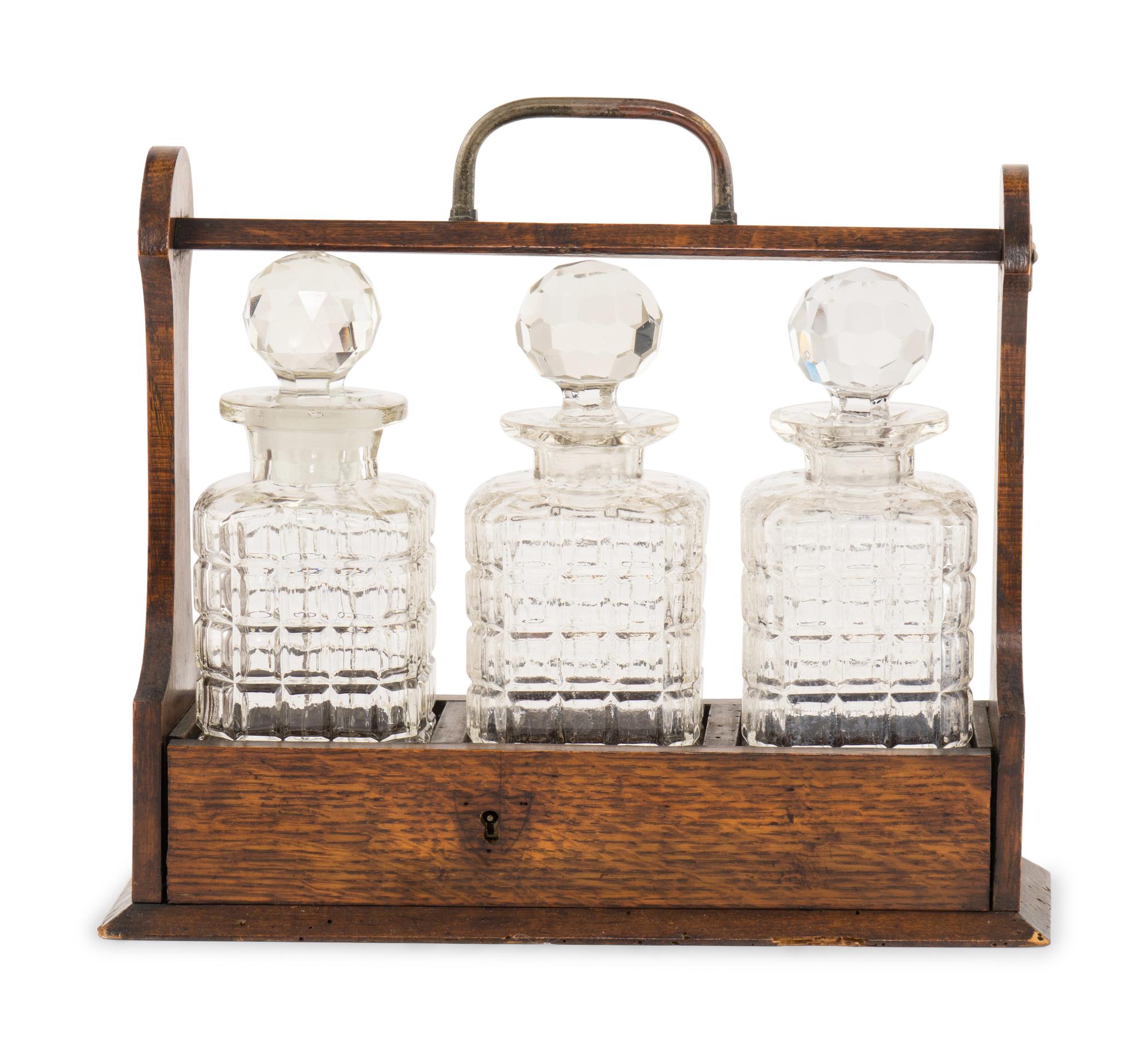 An English Oak and Cut Glass Tantalus