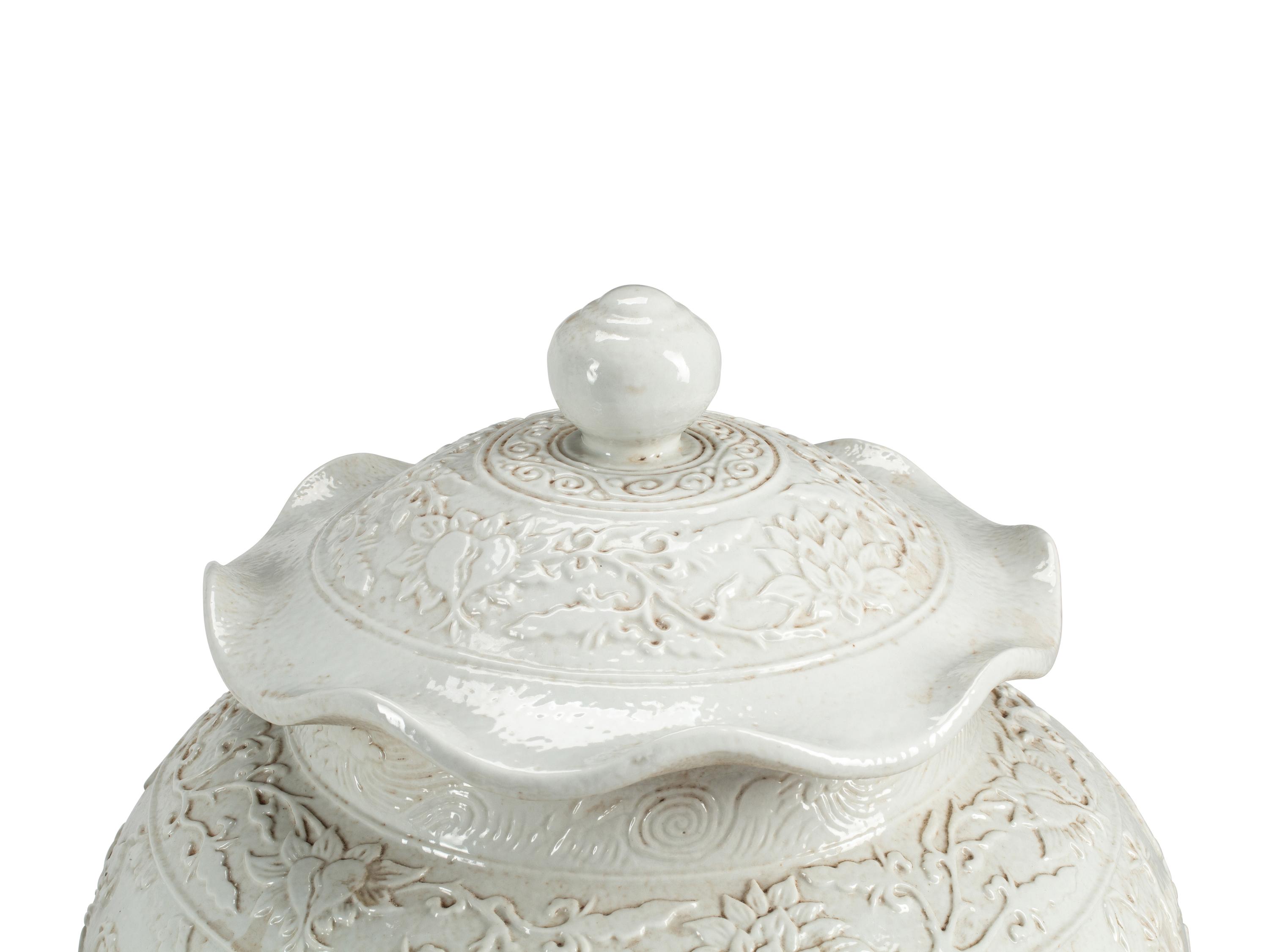 A Pair of Blanc de Chine Porcelain Jars on Gilt Bronze Stands