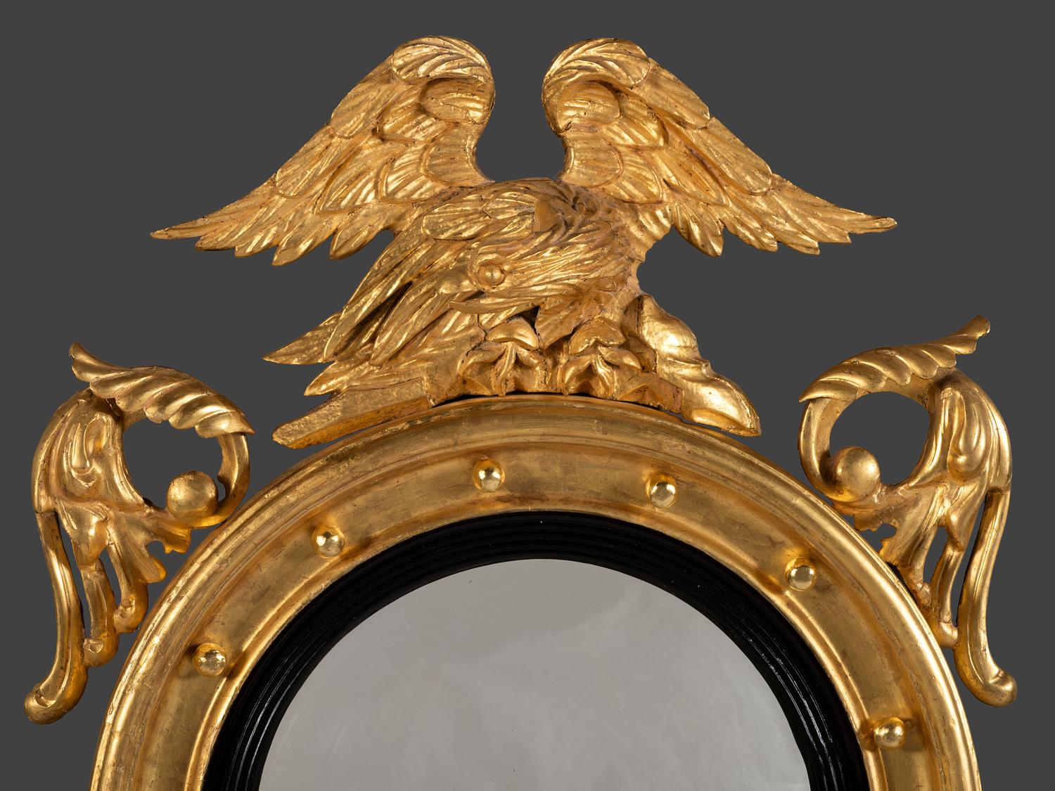 A Pair of Federal Giltwood Bull's Eye Looking Glasses