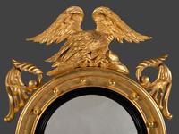 A Pair of Federal Giltwood Bull's Eye Looking Glasses