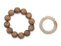 A Chinese Jade 'Dragon' Pendant and a Strand of Wood Praying Beads
