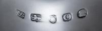 A Pair of George III Silver Sauce Boats, Hester Bateman, London, 1789, each having a foliate scroll handle and a beaded edge, raised on