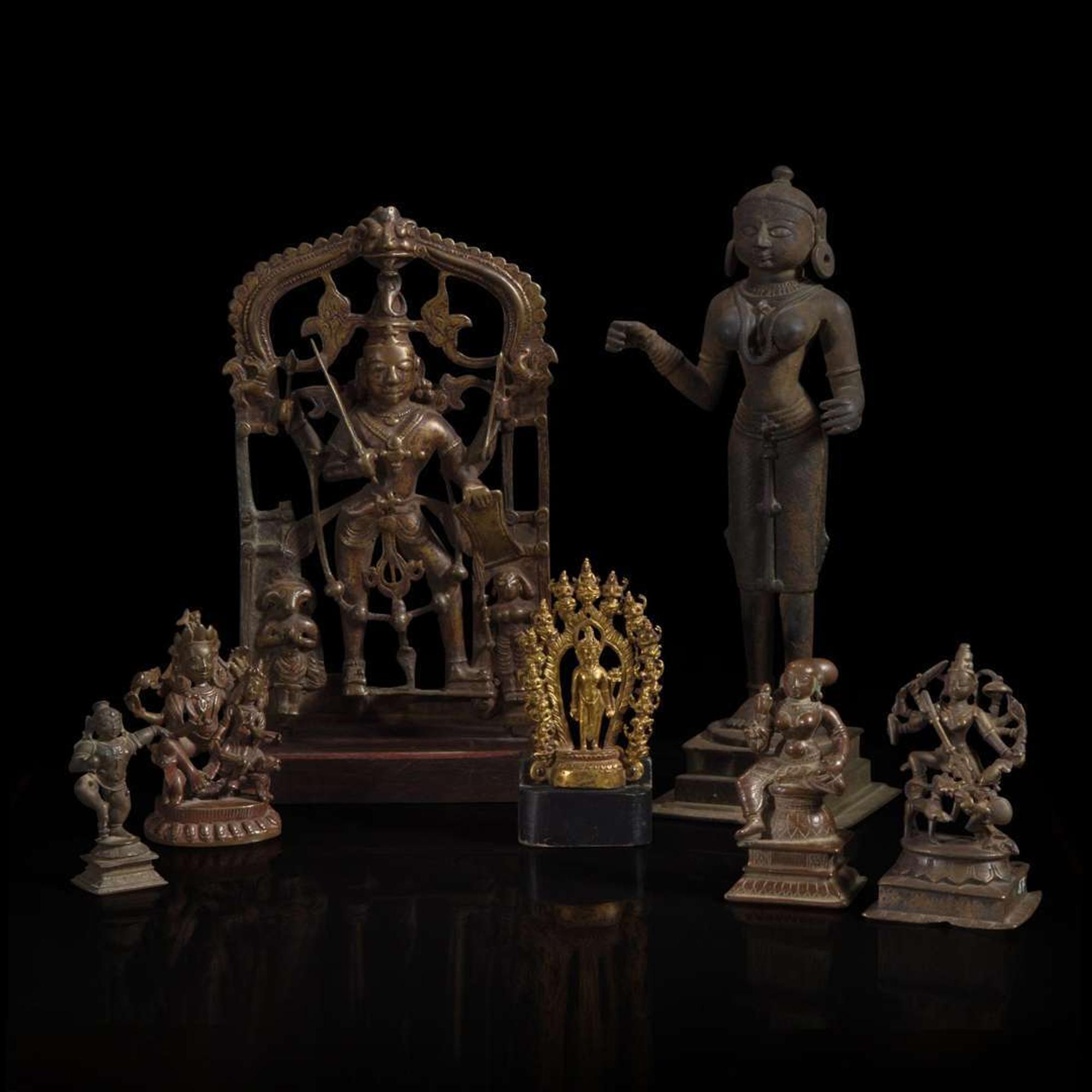 A group of seven assorted Indian and Himalayan bronzes 印度及喜马拉雅铜佛造像一组七件 17th/18th century and later ??????????