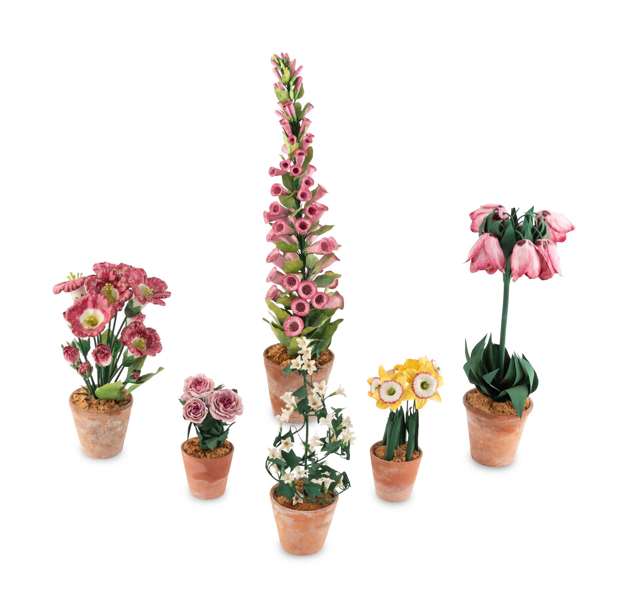 A Group of Tole and Porcelain Models of Flowers