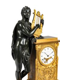 A Restauration Gilt and Patinated Bronze Mantel Clock with Orpheus and a Lyre
