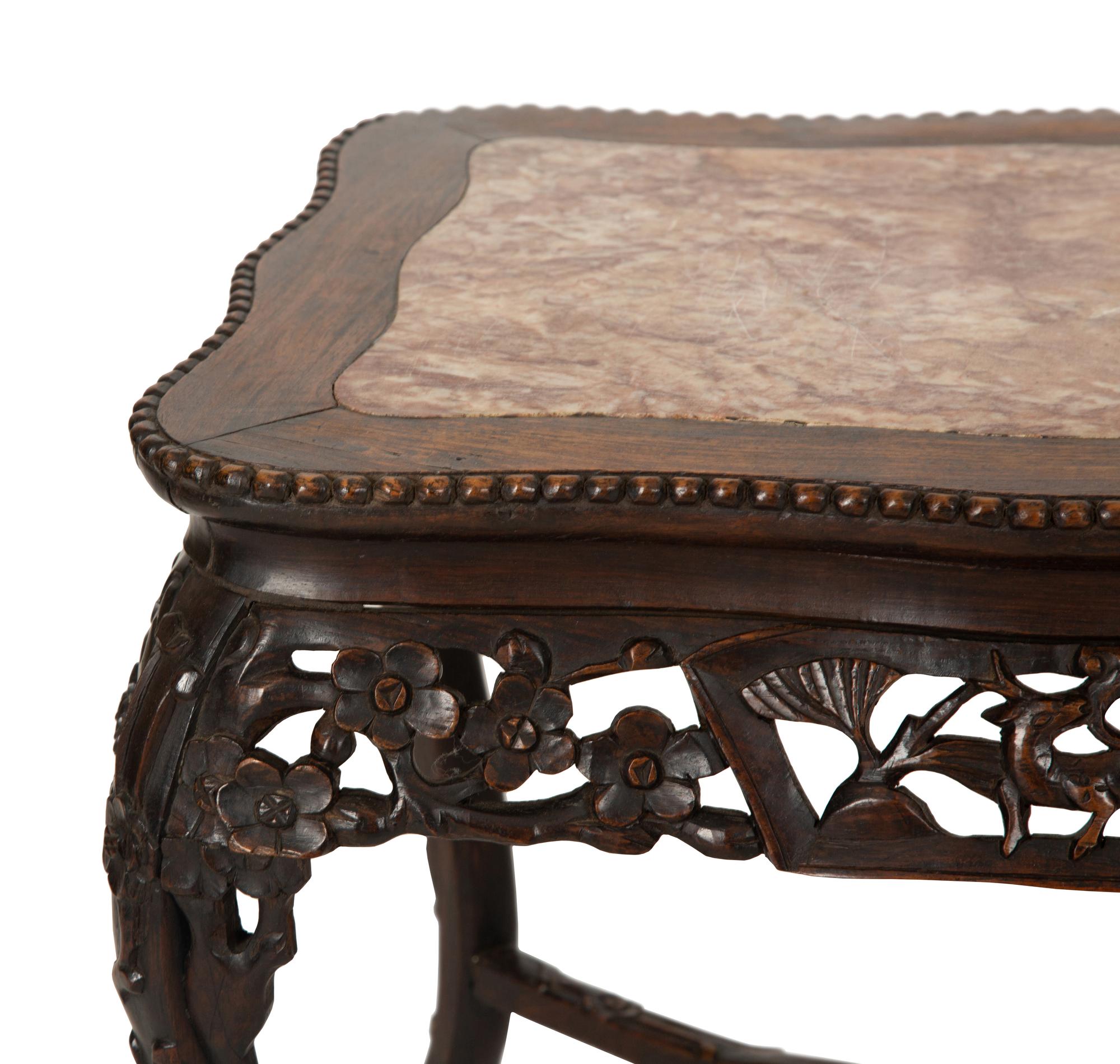 A Chinese Carved Hardwood Low Table with Marble Inset Top