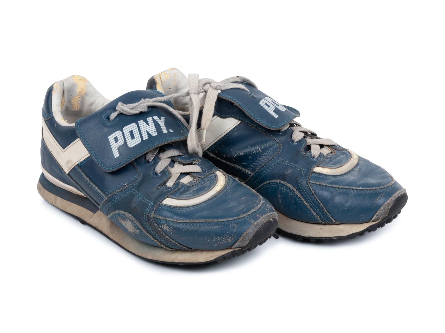 A Pair of Greg Maddux Game Used Pony Cleats,