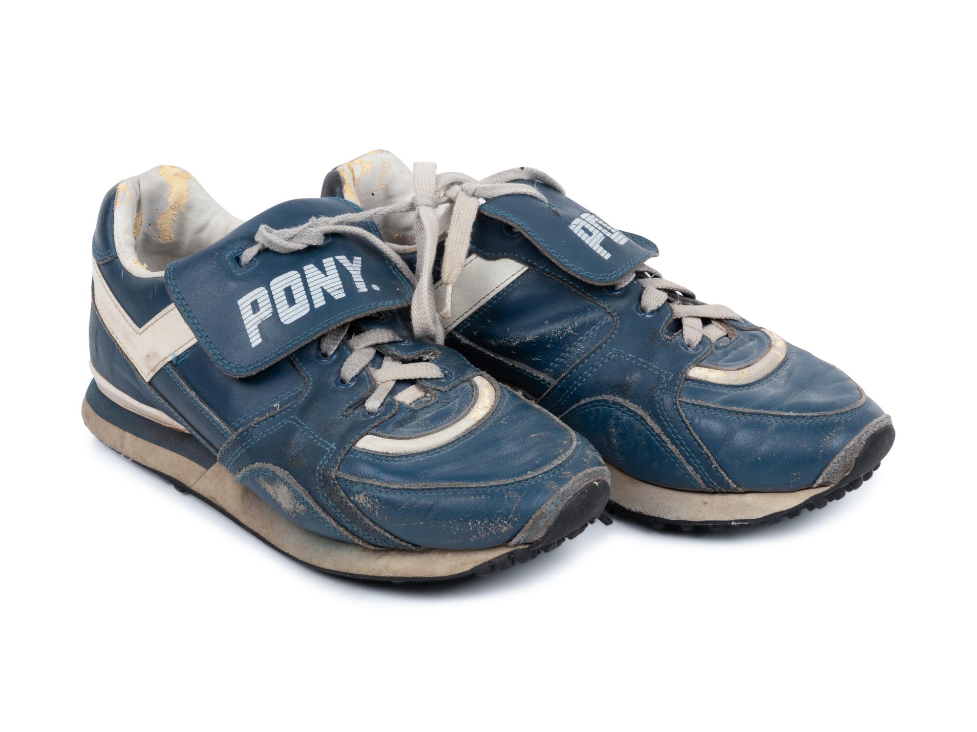 A Pair of Greg Maddux Game Used Pony Cleats,