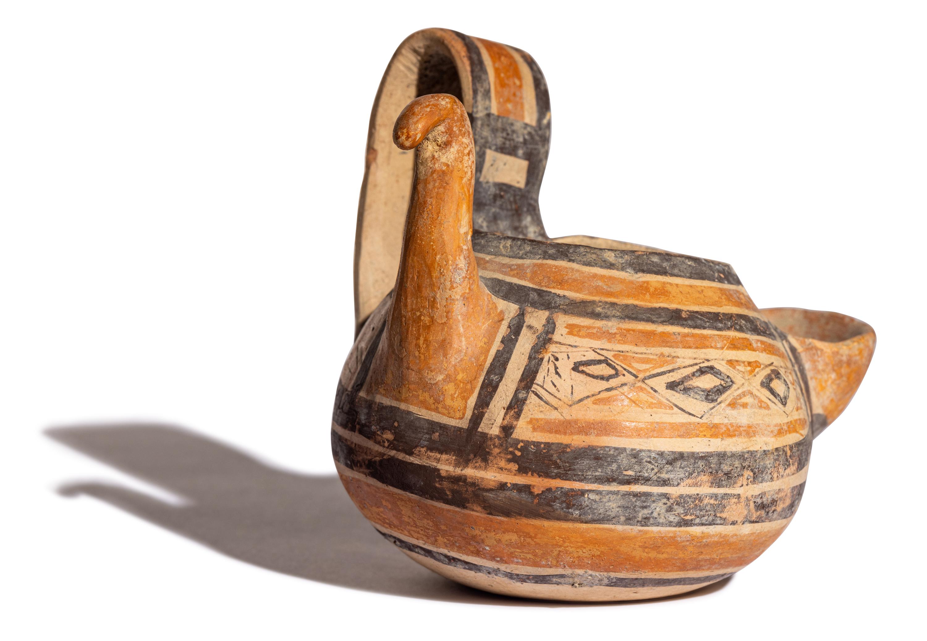 A Daunian Painted Pottery Figural Vessel in the Form of a Bird