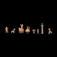 Eight Near Eastern Terracotta Figurines and Vessels