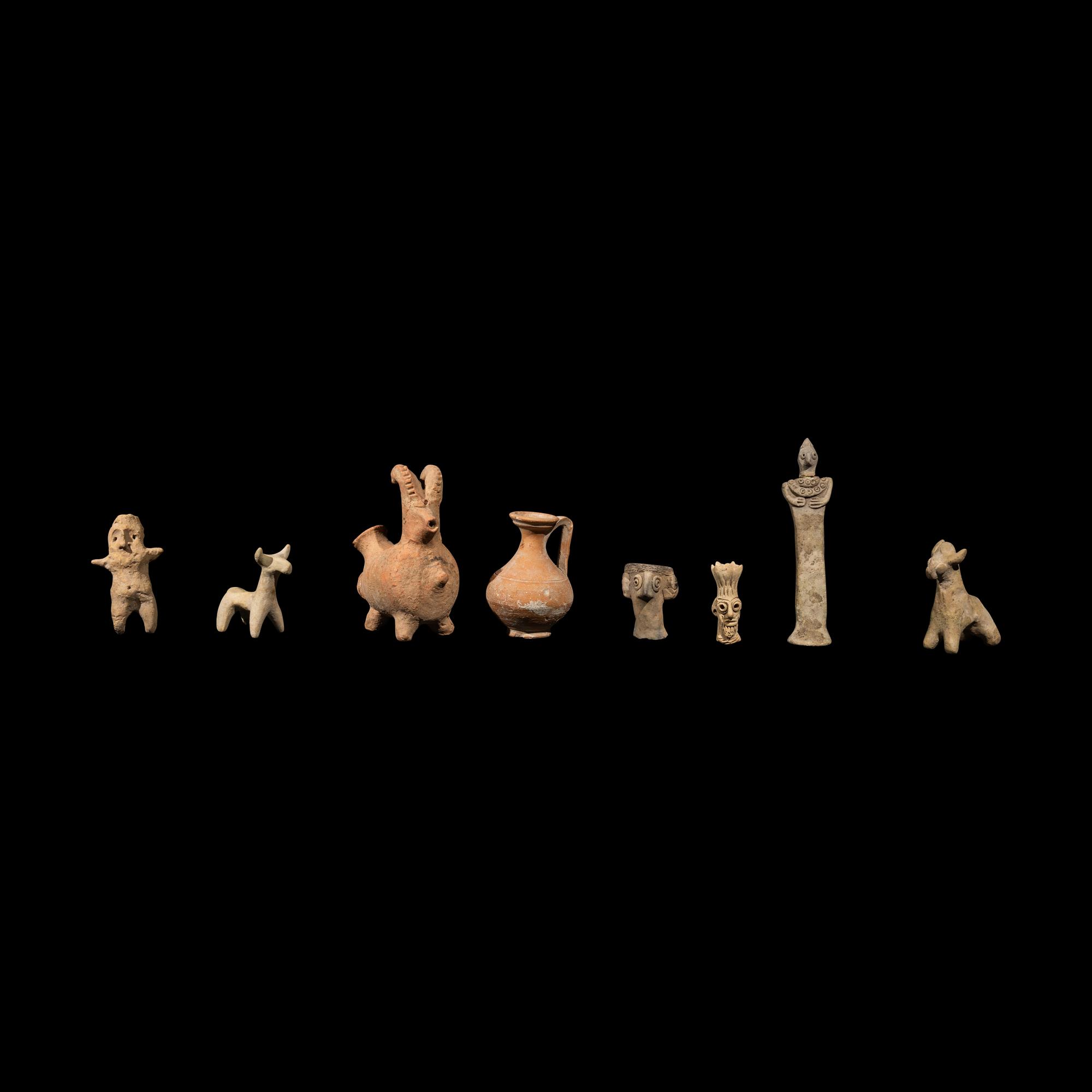 Eight Near Eastern Terracotta Figurines and Vessels