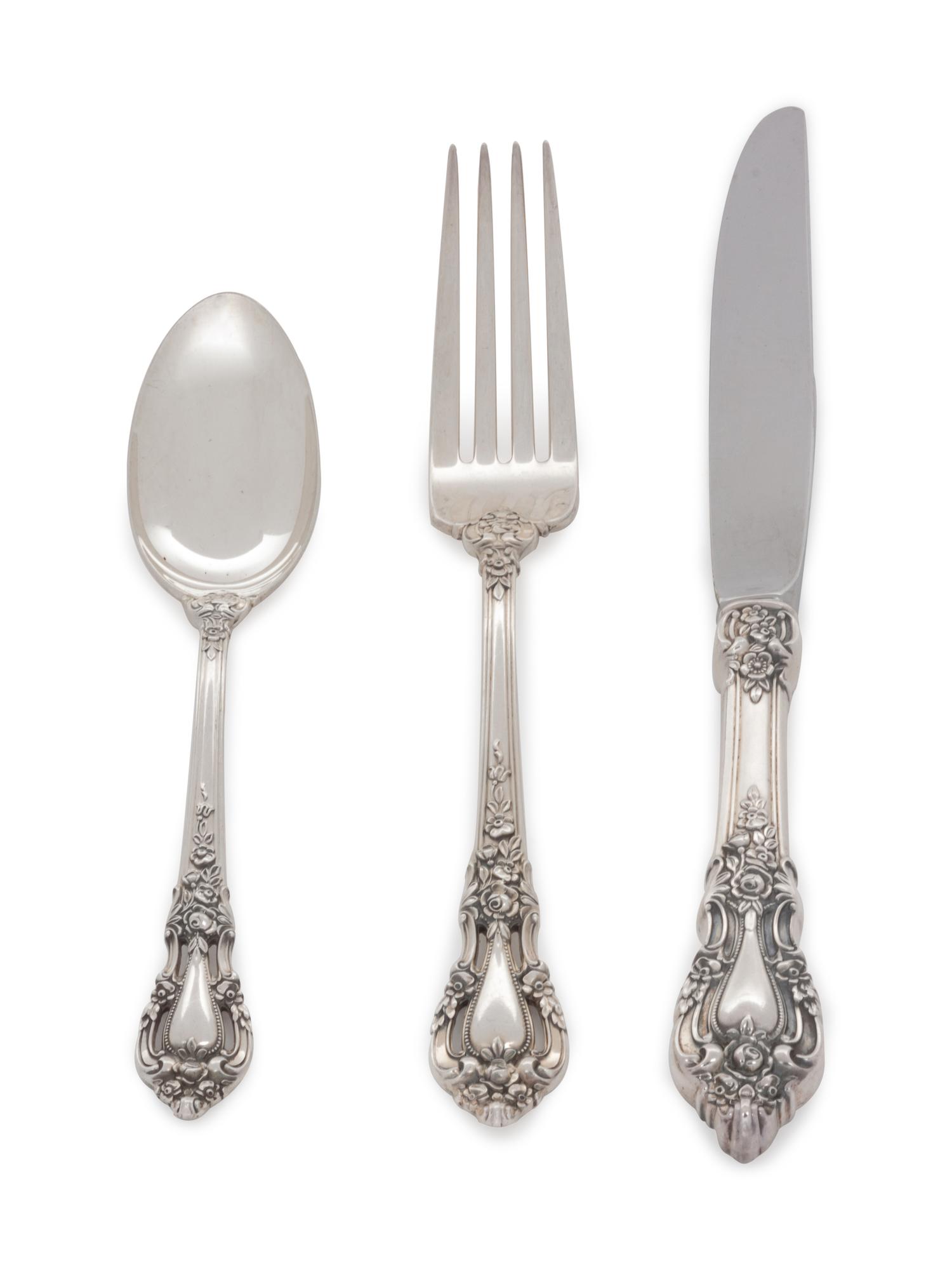 Eloquence pattern, comprising 8 dinner knives with stainless steel blades 6 steak knives with stainless steel blades 8 butter knives with stainless steel blades 1 master butter knife with stainless steel blade 8 dinner forks 8 salad forks 10 cocktail forks 1 cold meat fork 12 teaspoons 8 soup spoons 1 serving spoon 1 slotted spoon 1 sugar spoon 1 ladle 74 pieces total.