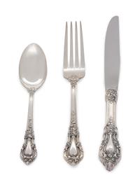 Eloquence pattern, comprising 8 dinner knives with stainless steel blades 6 steak knives with stainless steel blades 8 butter knives with stainless steel blades 1 master butter knife with stainless steel blade 8 dinner forks 8 salad forks 10 cocktail forks 1 cold meat fork 12 teaspoons 8 soup spoons 1 serving spoon 1 slotted spoon 1 sugar spoon 1 ladle 74 pieces total.