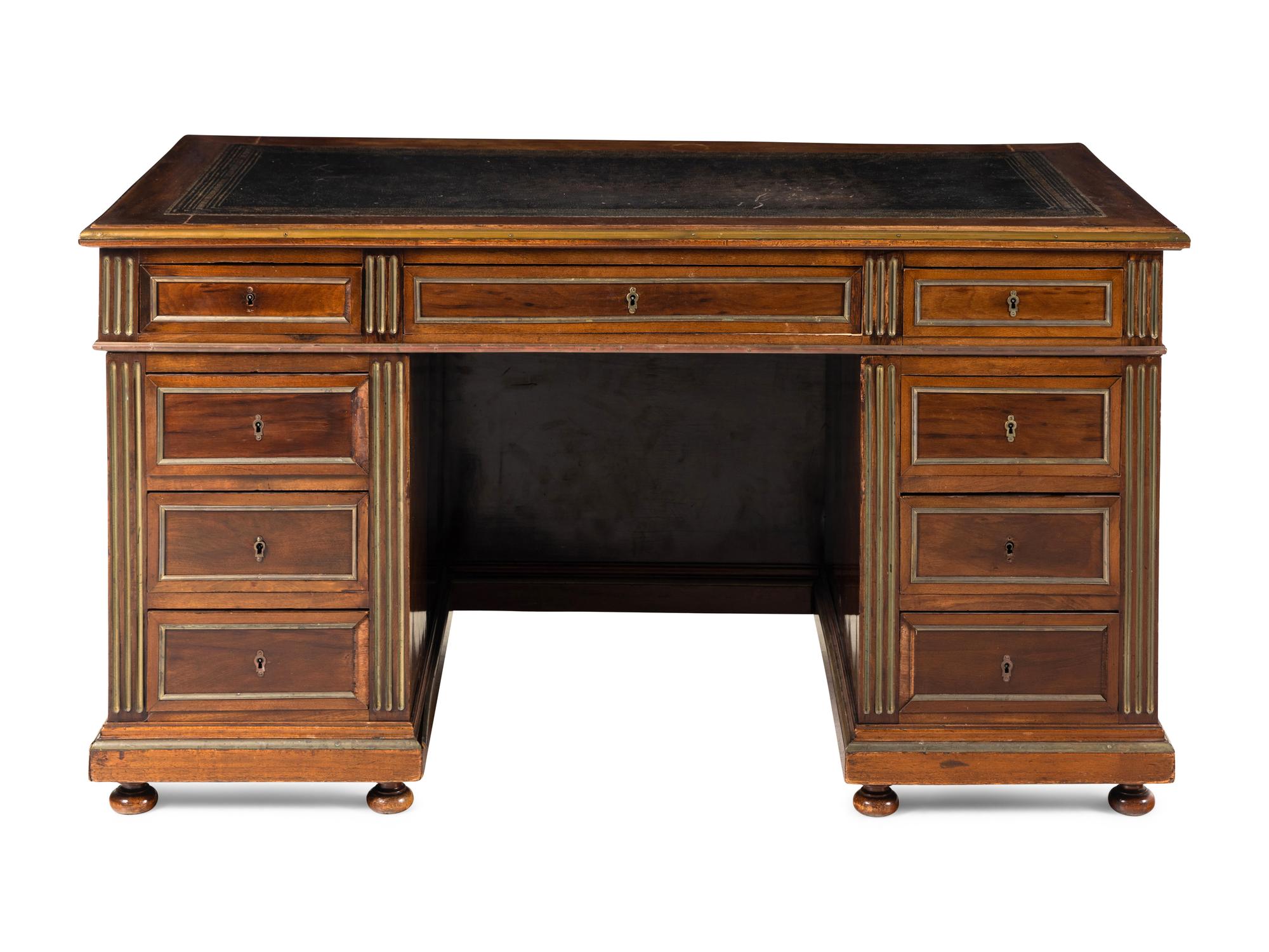 A Directoire Style Brass Mounted Mahogany Pedestal Desk