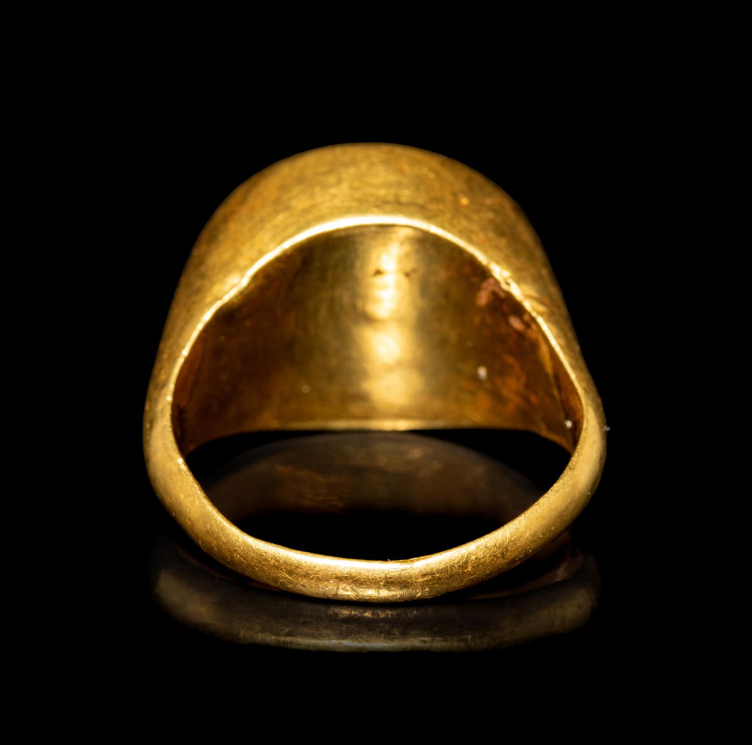 A Hellenistic Gold and Garnet Finger Ring with the God Eros