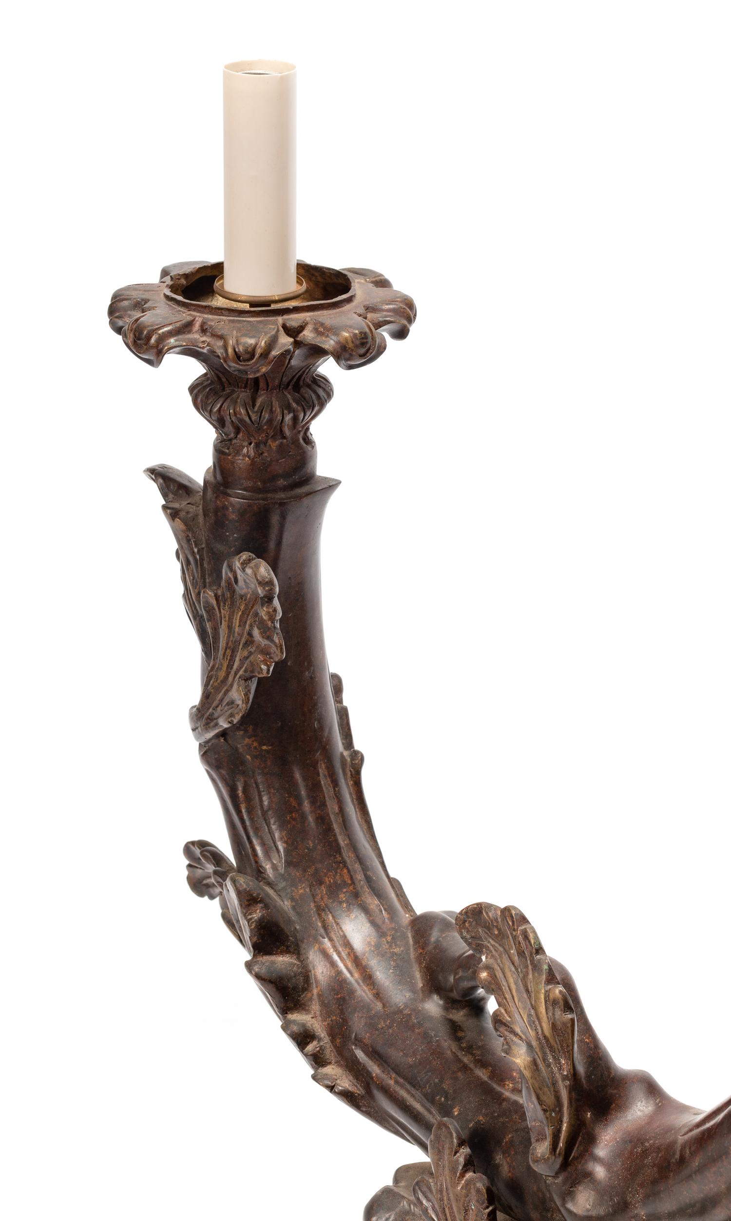 A Black Forest Style Patinated Bronze Chandelier