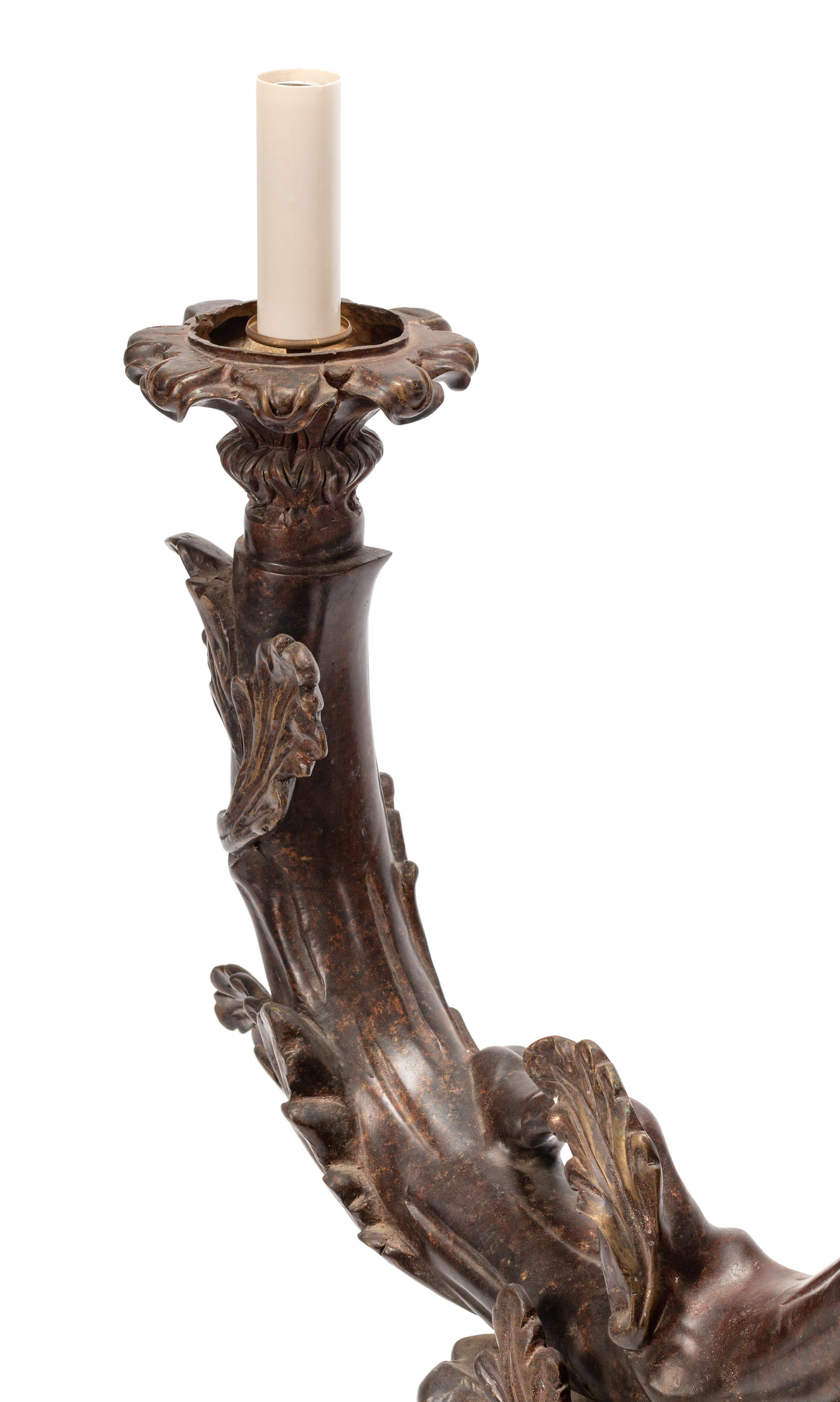 A Black Forest Style Patinated Bronze Chandelier