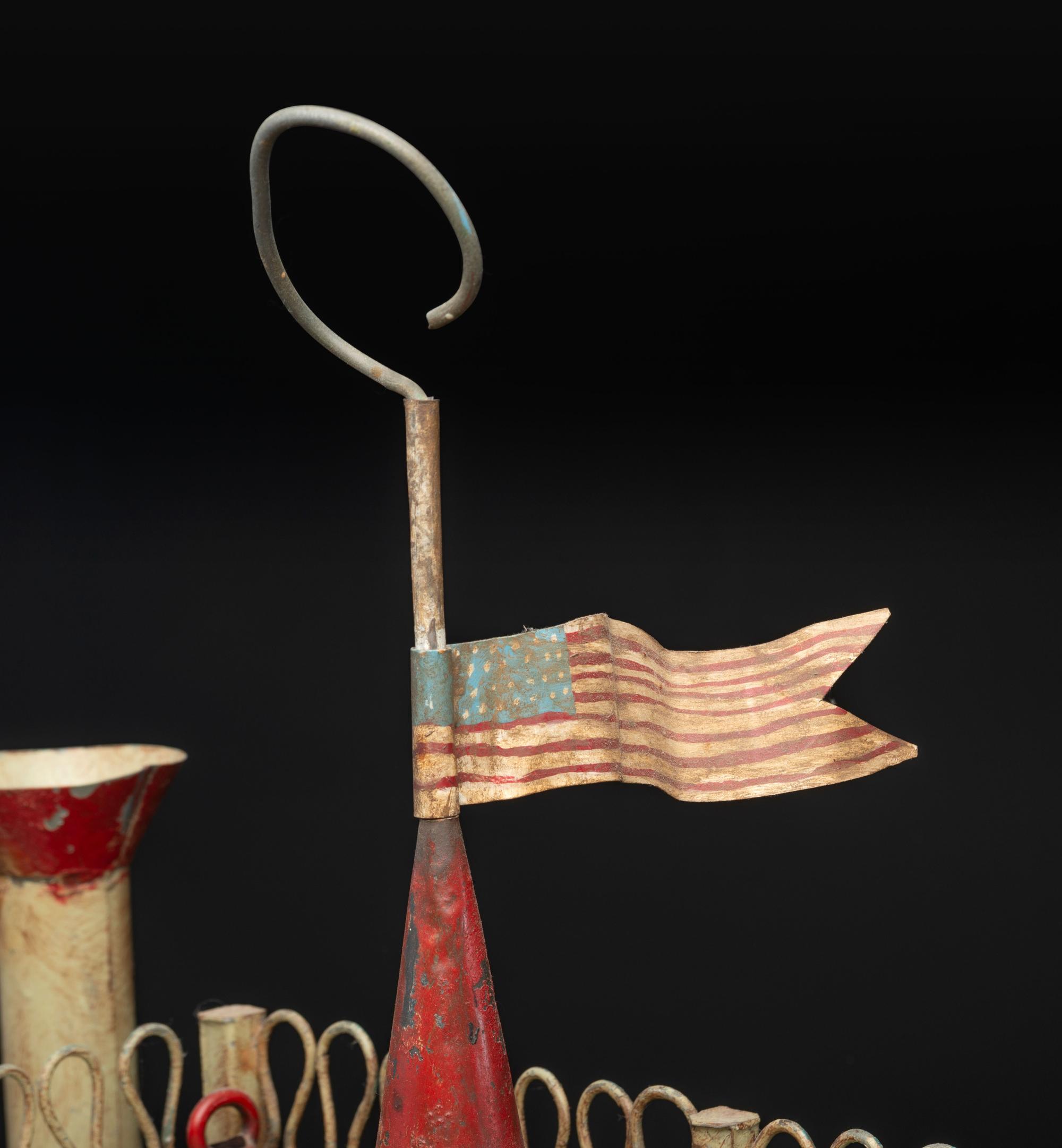 A Painted Sheet Metal and Wire Steamboat Form Birdcage