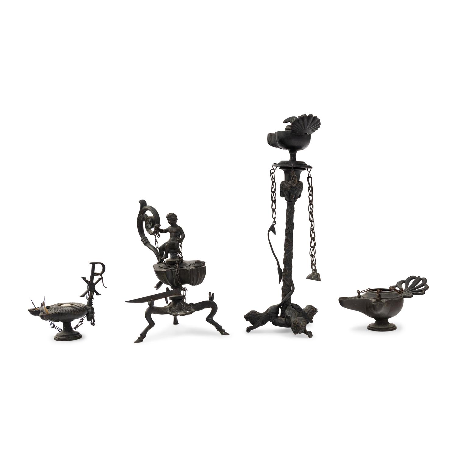 A Collection of Four Patinated Bronze Oil Lamps