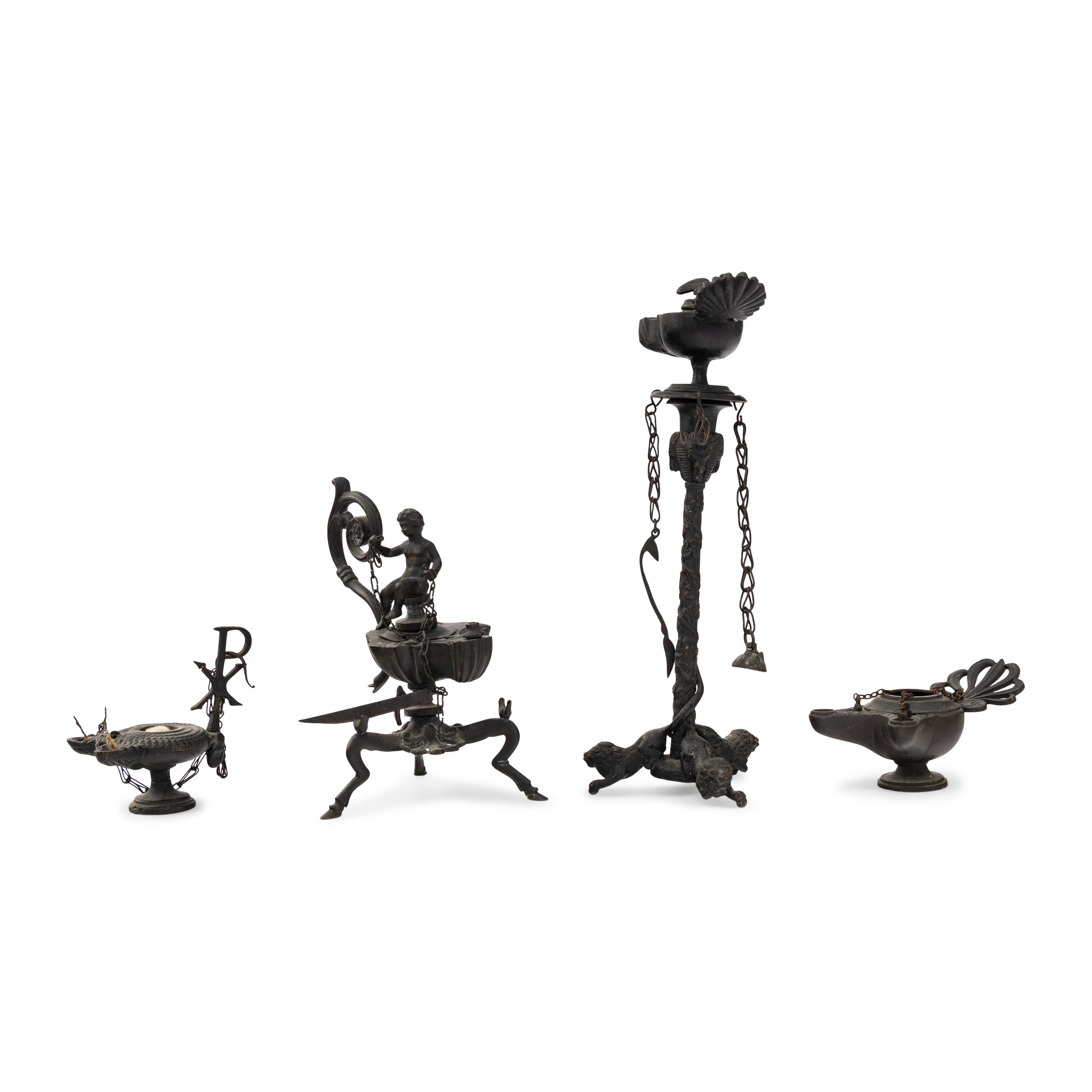 A Collection of Four Patinated Bronze Oil Lamps
