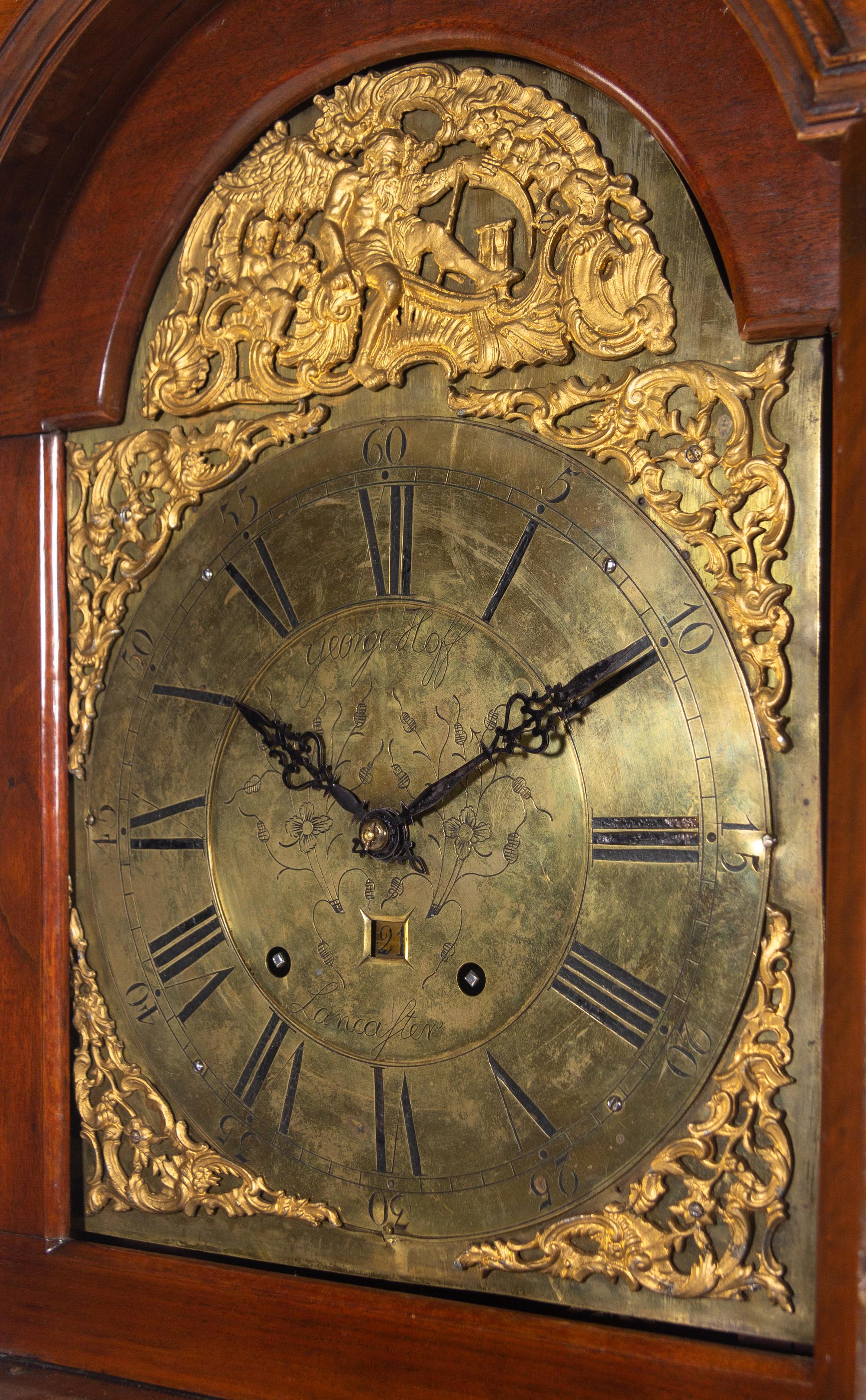A Queen Anne Walnut Tall Case Clock