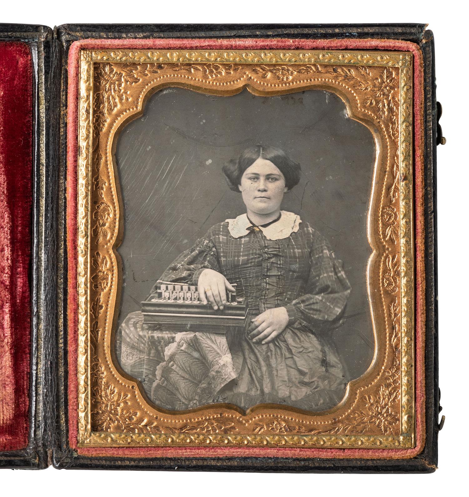 [EARLY PHOTOGRAPHY]. Sixth plate daguerreotype featuring a full-figured woman with a flutina.