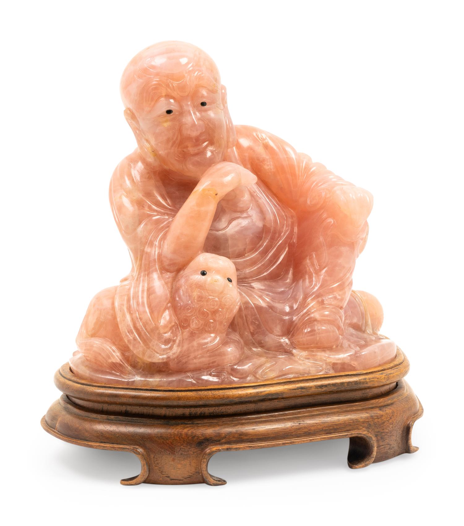 A Chinese Carved Rose Quartz Figure of a Luohan
