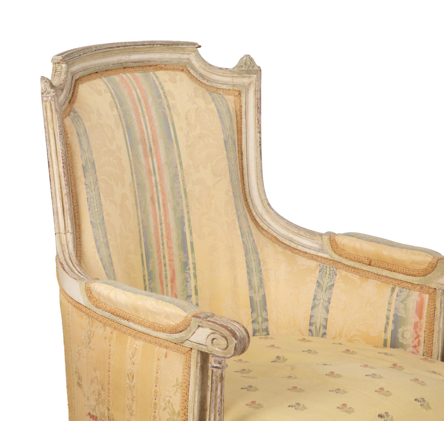A Pair of Louis XVI Style Painted and Upholstered Bergeres — 20TH CENTURY