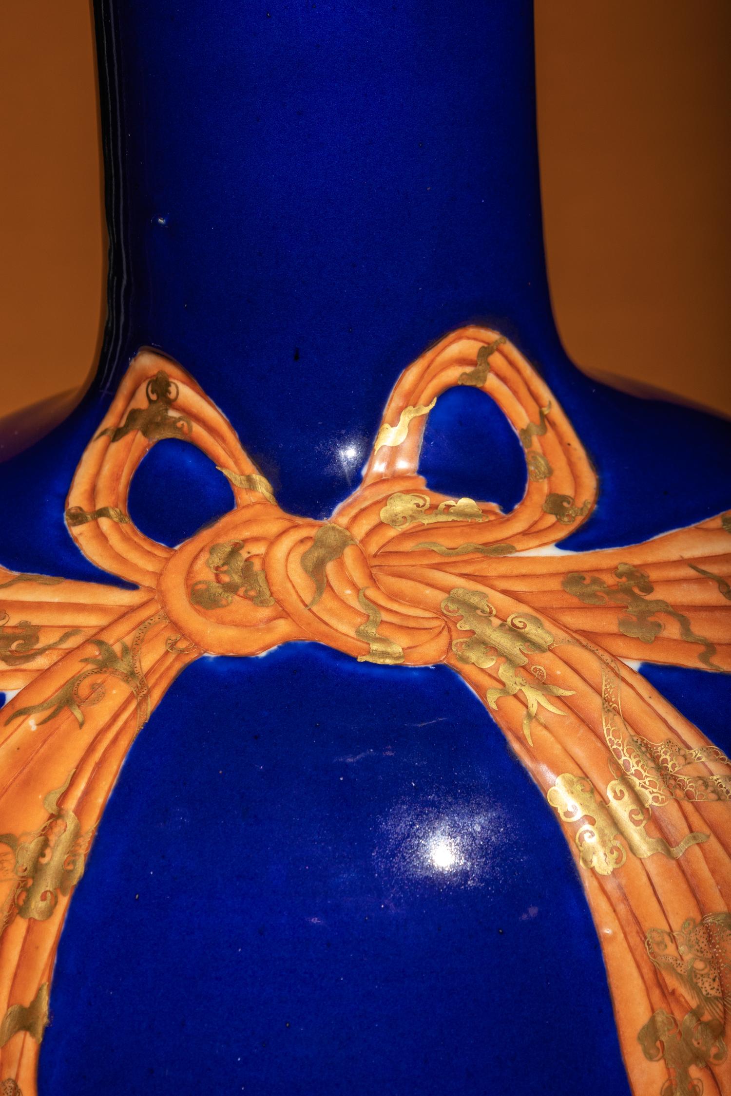 A Large Chinese Gilt and Iron Red Highlighted Blue Glazed Porcelain 'Ribbon-Tied' Vase, Tianqiuping, Late Qing Dynasty/Early Republic Period 晚清/民國 藍地描金包袱式天球瓶