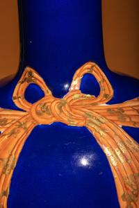 A Large Chinese Gilt and Iron Red Highlighted Blue Glazed Porcelain 'Ribbon-Tied' Vase, Tianqiuping, Late Qing Dynasty/Early Republic Period 晚清/民國 藍地描金包袱式天球瓶