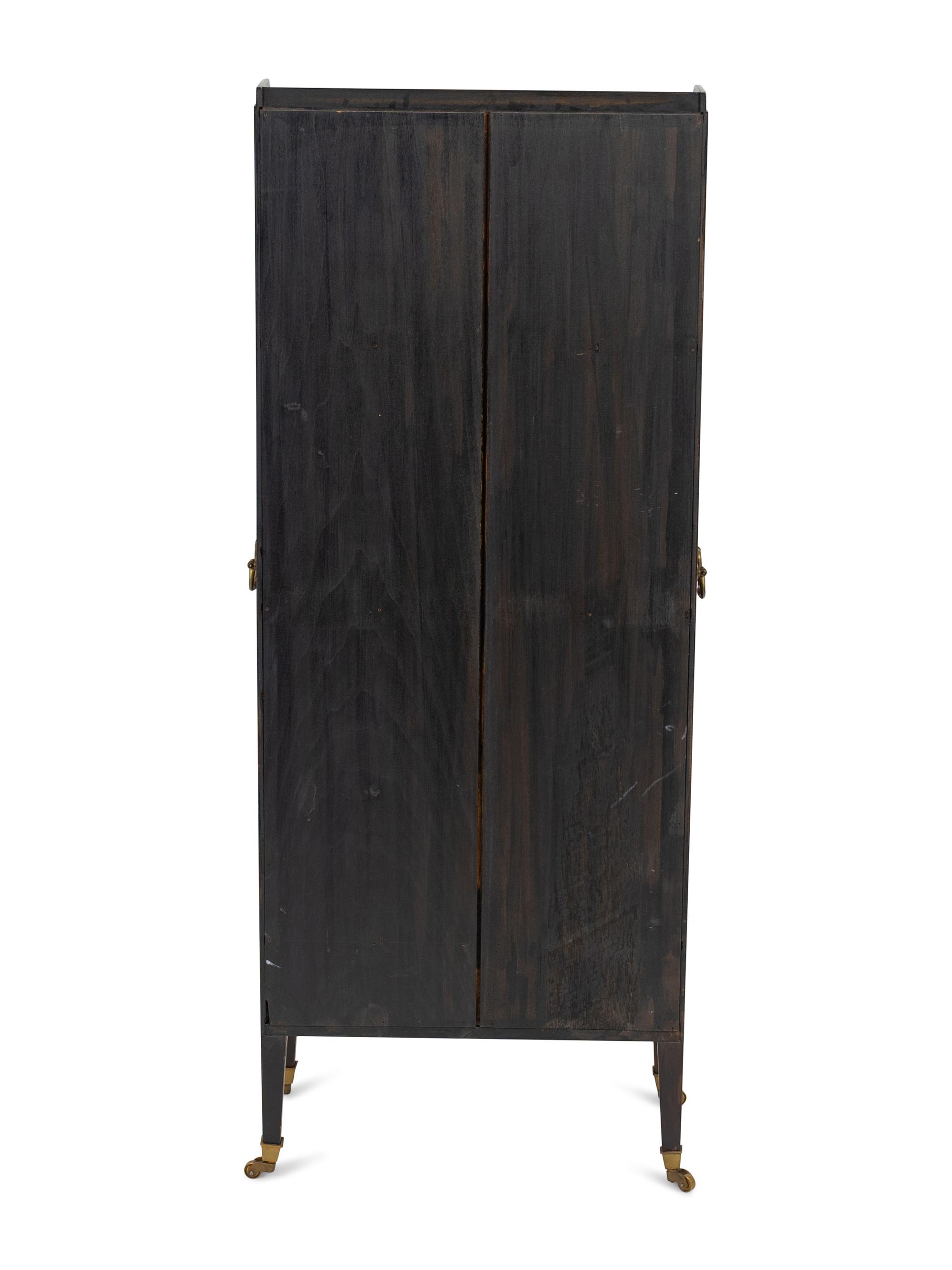 A Small Regency Ebonized and Gilt Decorated Waterfall Bookcase — 19TH CENTURY