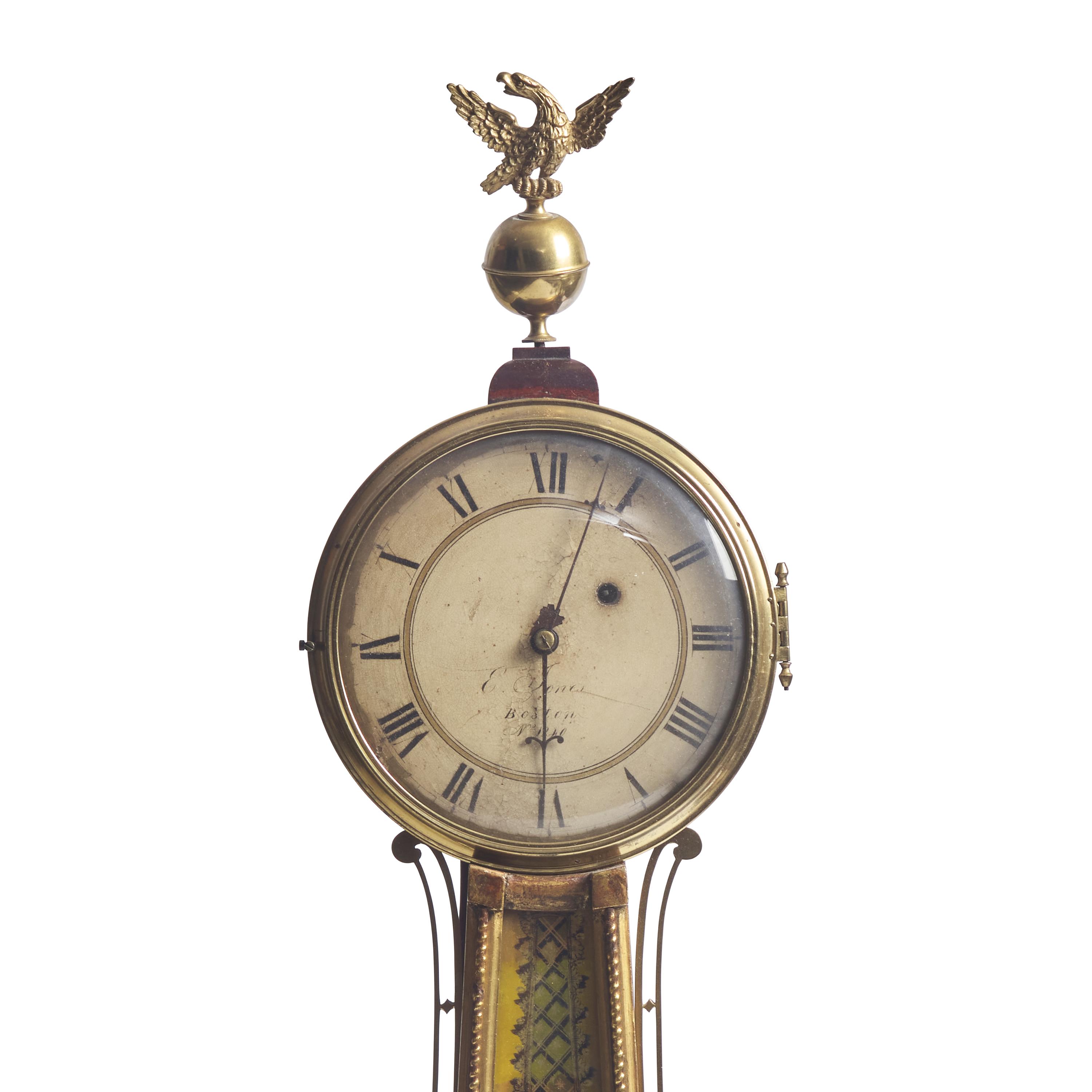 A Classical Parcel-Gilt, Brass-Mounted and Eglomise-Panel Inset Banjo Clock