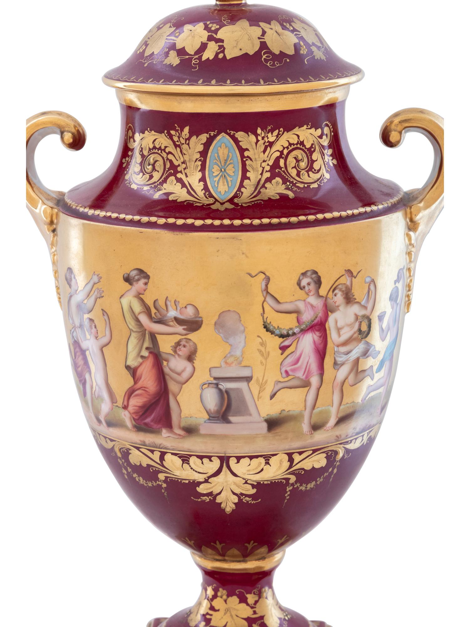 A Vienna Style Painted and Parcel Gilt Porcelain Covered Urn