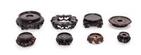 Eight Chinese Hardwood Stands Diameter of largest 3 1/2 inches. — 19TH-20TH CENTURY