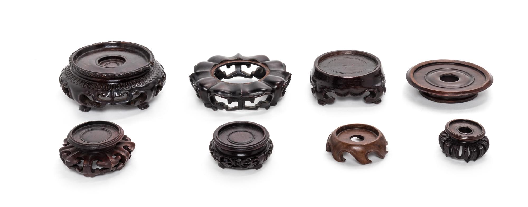 Eight Chinese Hardwood Stands Diameter of largest 3 1/2 inches. — 19TH-20TH CENTURY